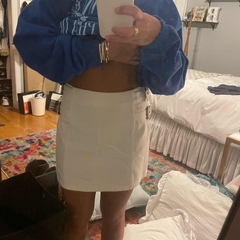 Stylish white Mini Skirt with belt buckles